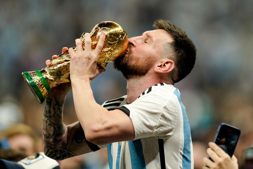 Lionel Messi of Argentina kisses the trophy 