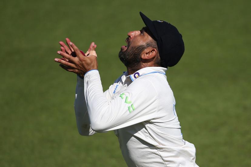 Cheteshwar Pujara of Sussex catches the ball 