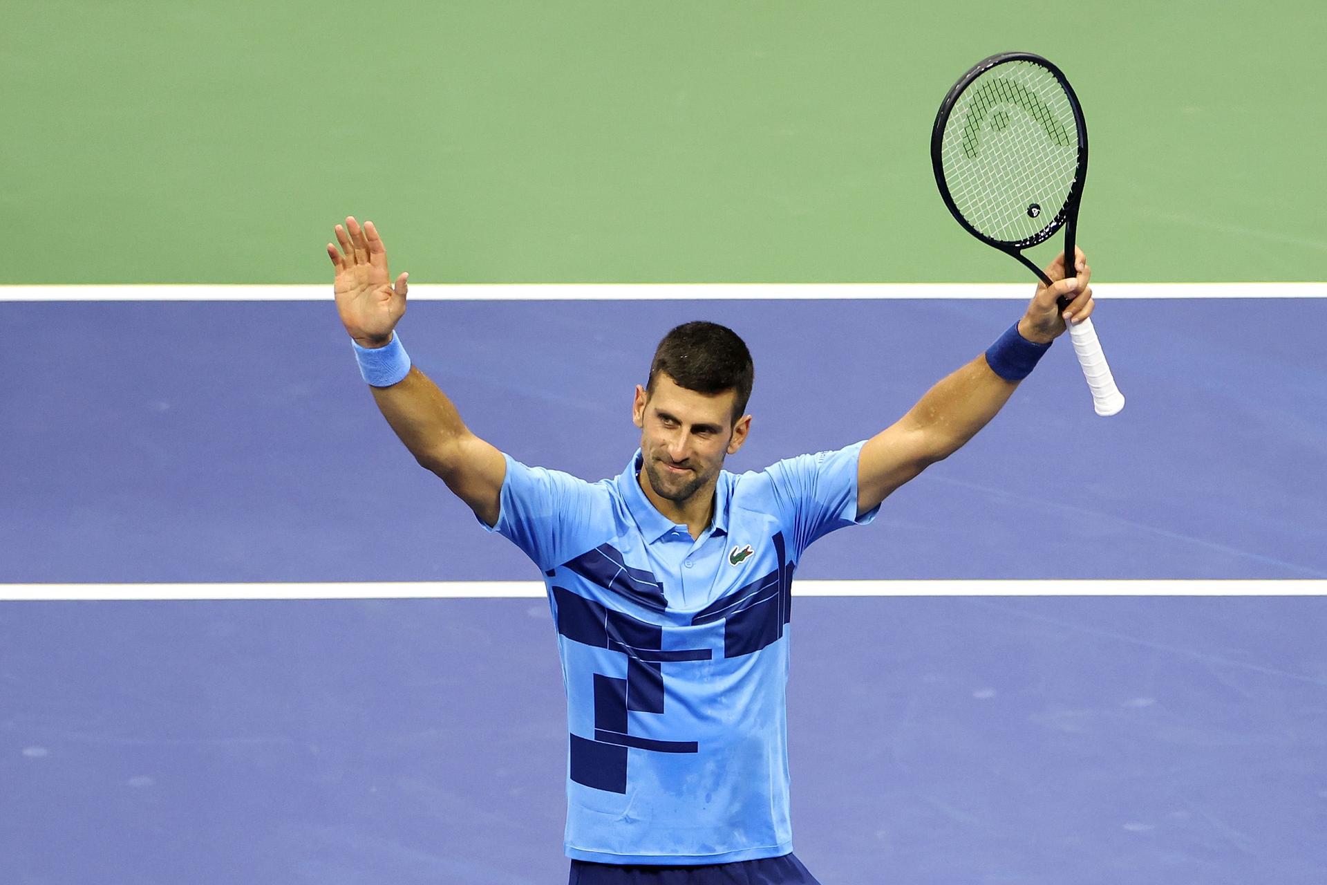 Novak Djokovic of Serbia celebrates after defeating Radu Albot of Moldova 