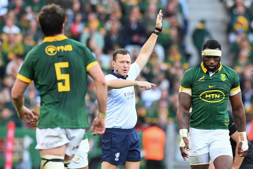 British referee Matthew Carley (C) gestures 