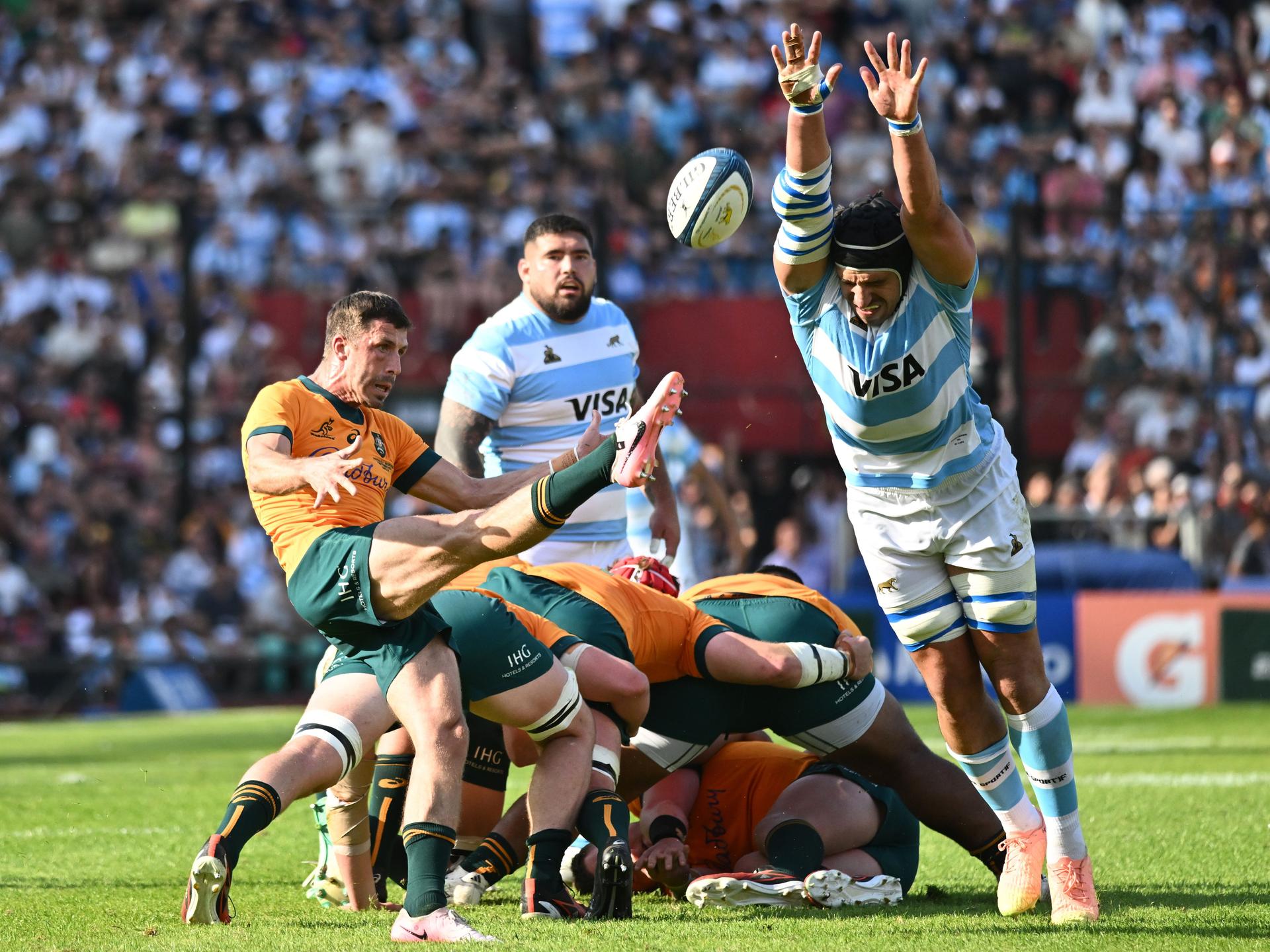 Tomas Lavanini of Argentina blocks a kick by Jake Gordon of Australia 