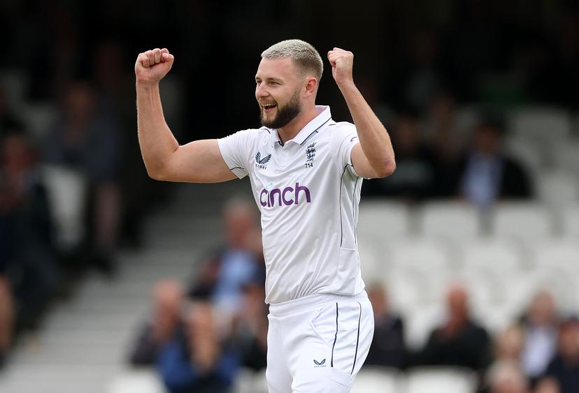 Gus Atkinson of England celebrates taking the wicket 