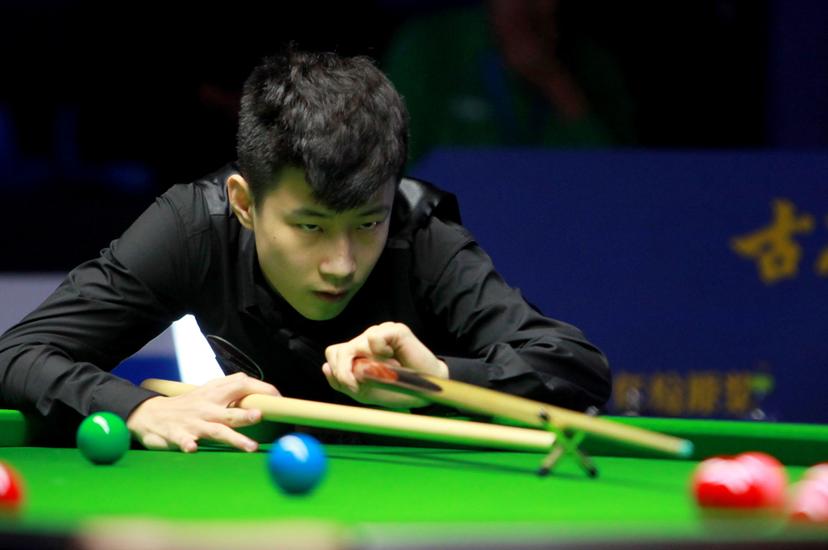 Zhao Xintong of China reacts against Rory McLeod