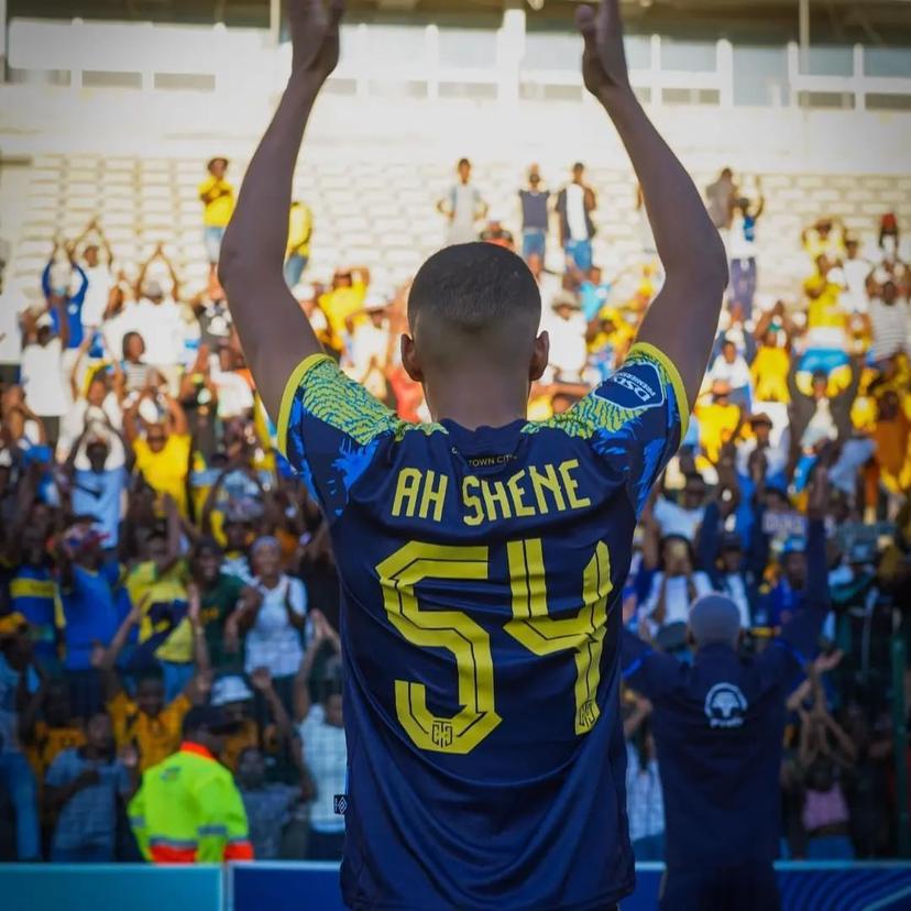 Footballer Jody Ah Shene celebrating towards the fans during a football match 