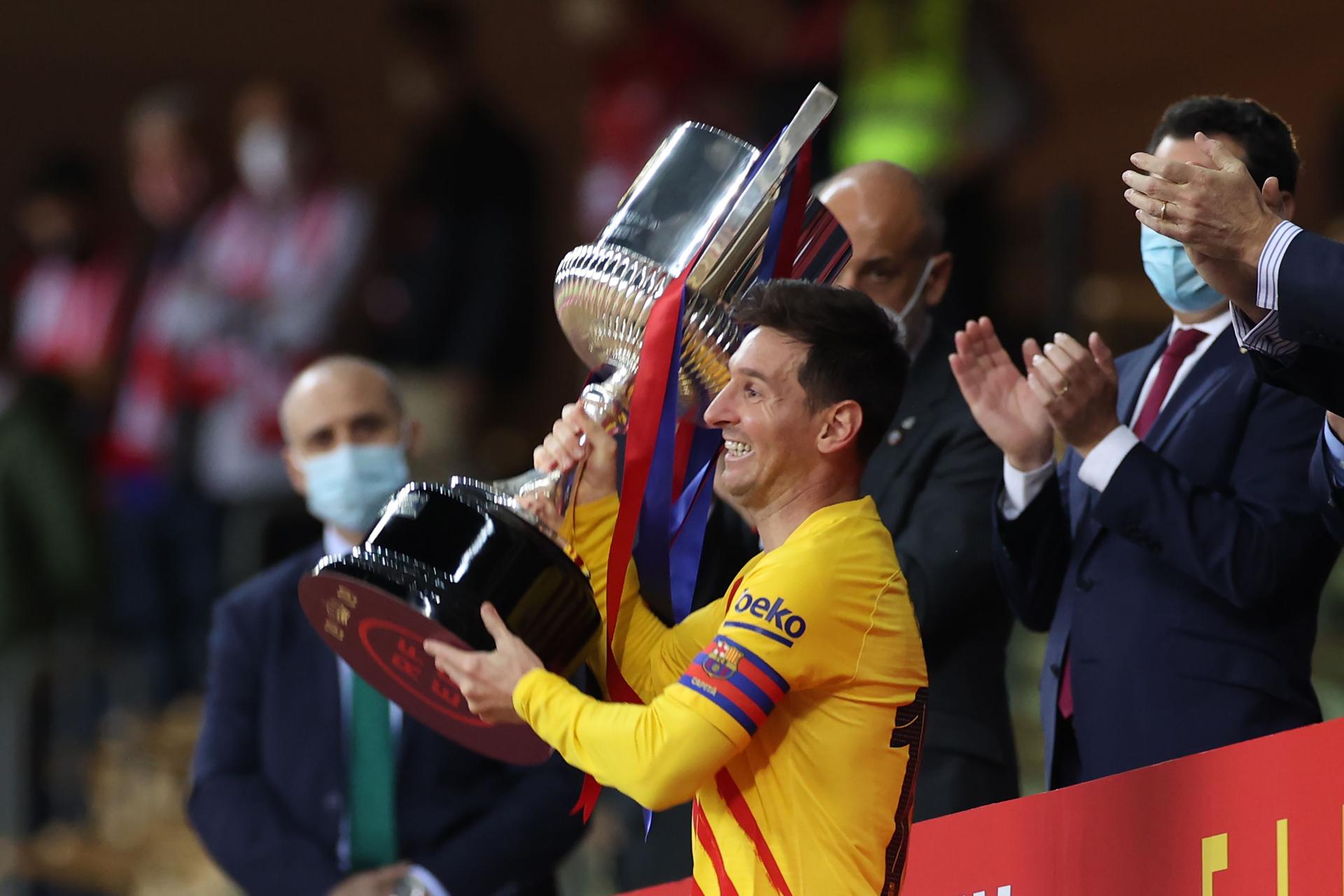 Lionel Messi of FC Barcelona lifts the rophy after winning the Copa Del Rey.jpg