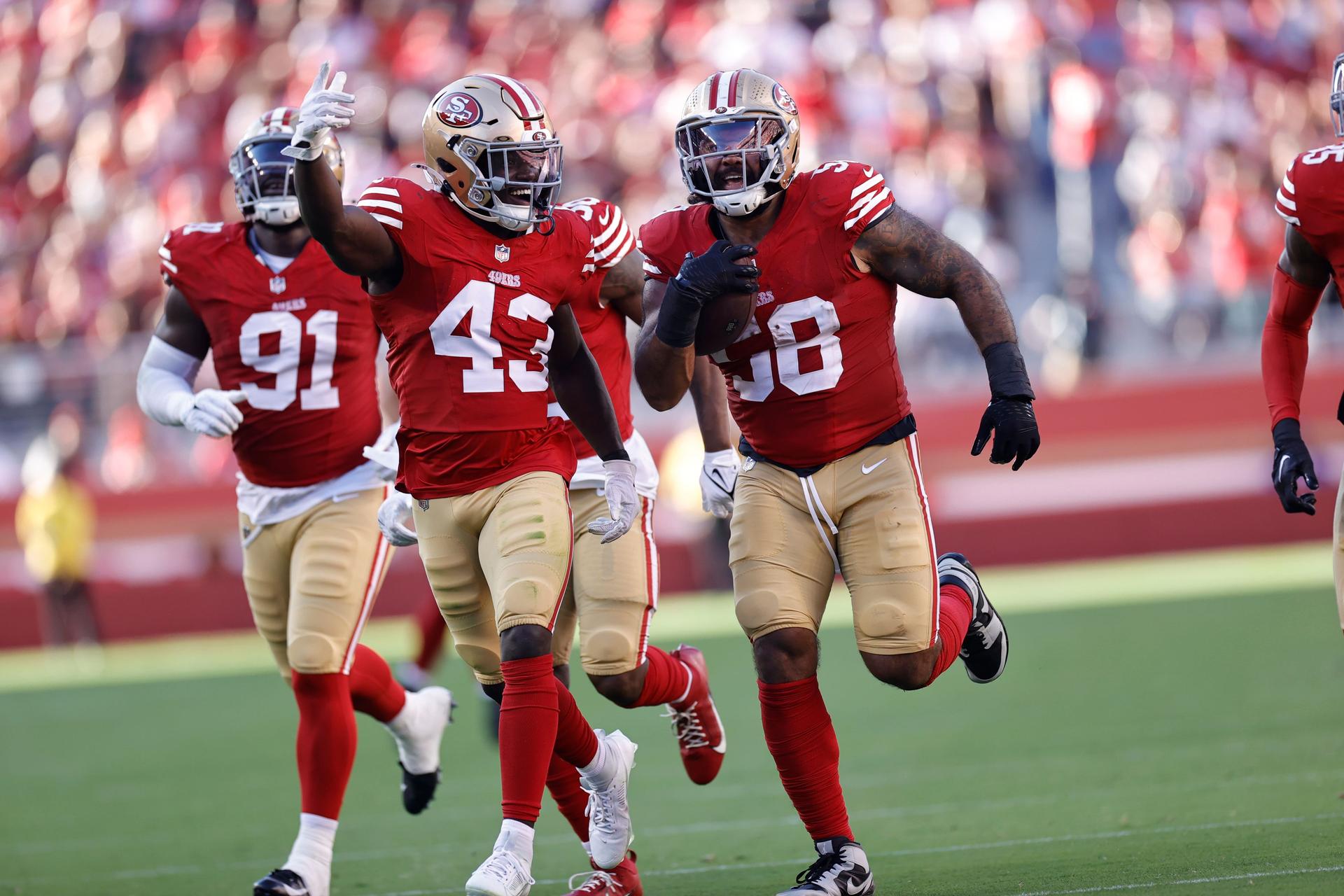 Malik Mustapha #43 and Alex Barrett #58 of the San Francisco 