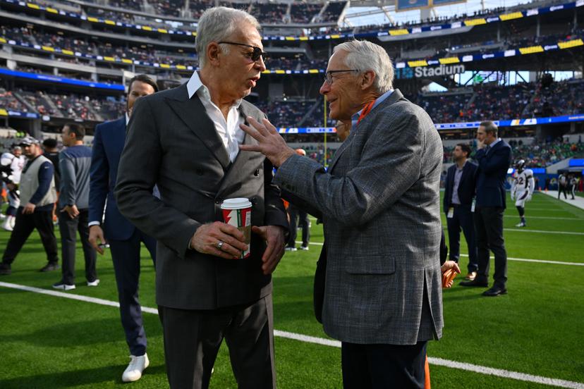 Owner Stan Kroenke of the Los Angeles Rams talks with owner Rob Walton